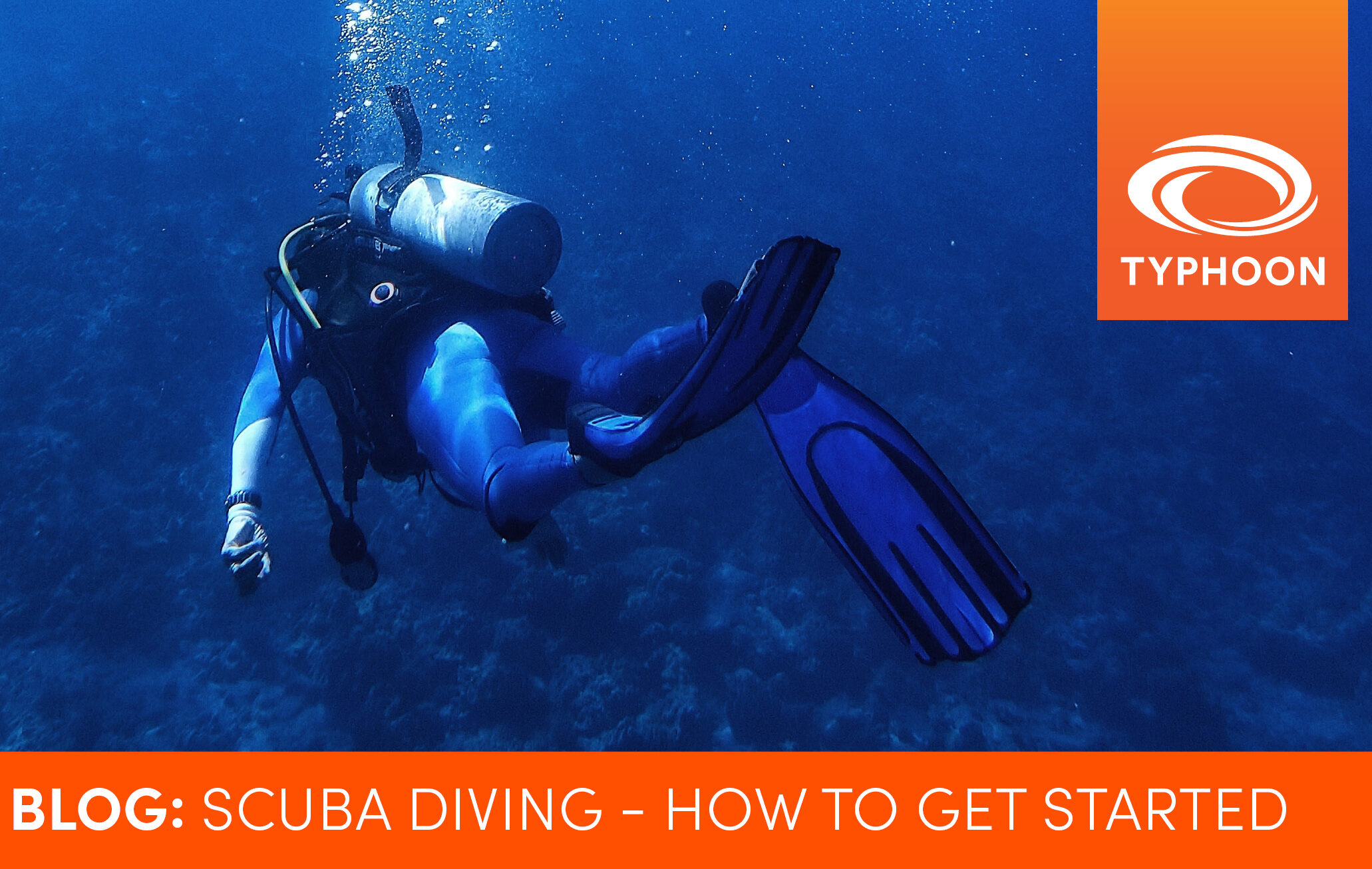 A scuba diver swimming deep in the ocean with the caption 'BLOG: Scuba Diving: How to get started'